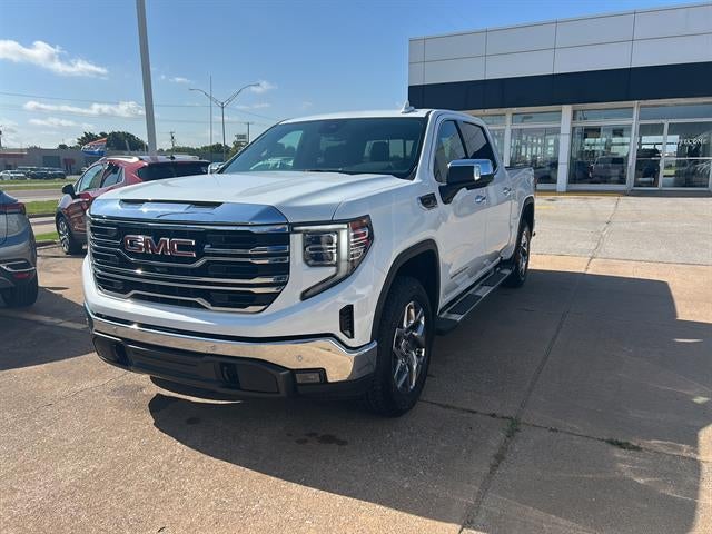 2026 GMC Sierra 1500 SLT in Summit White — front three-quarter view