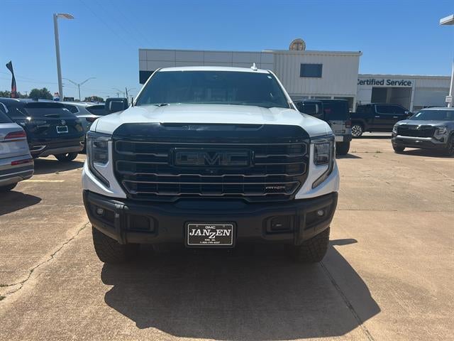 2023 GMC Sierra 1500 AT4X in Summit White — front three-quarter view